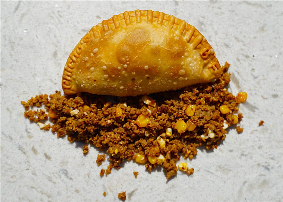 Beef empanada with a golden fried crust