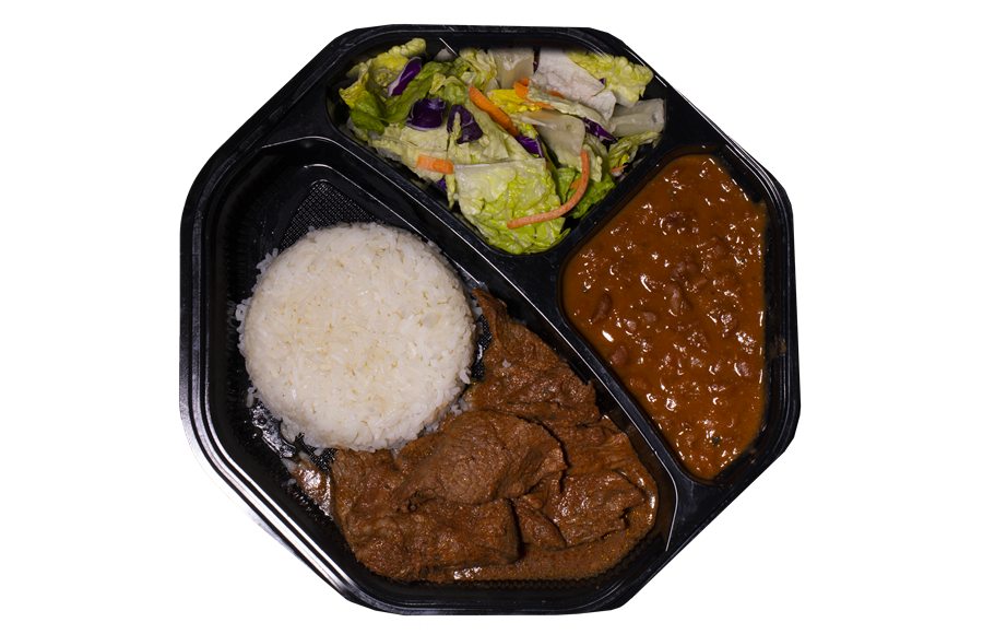 Beef guisada plate with rice, beans and salad