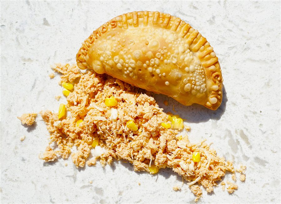 Chicken empanada with a golden fried crust