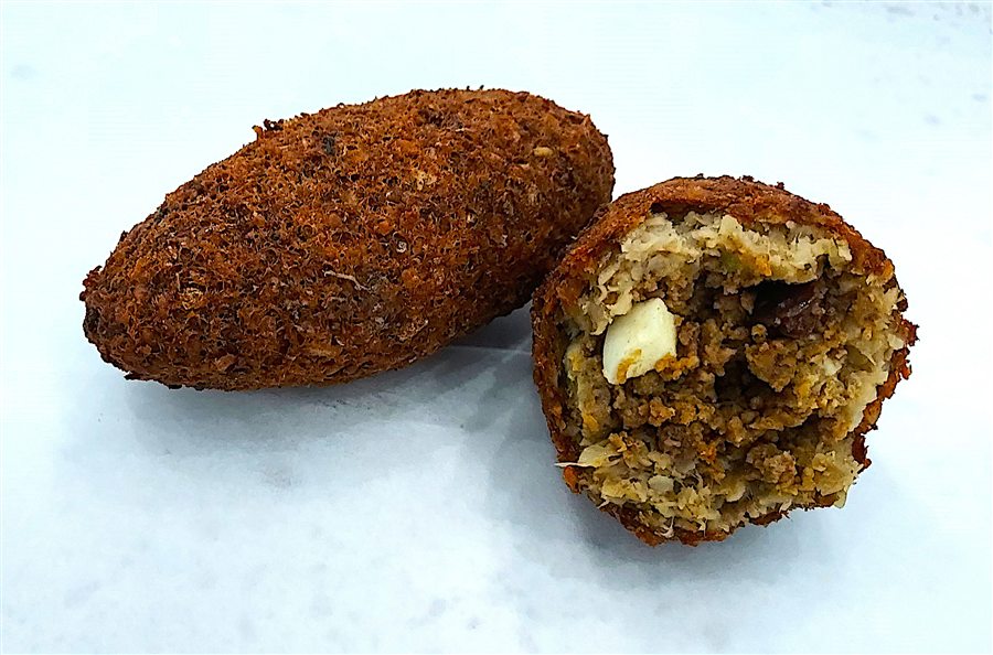 Kipe, a fried bulgur wheat fritter filled with seasoned beef