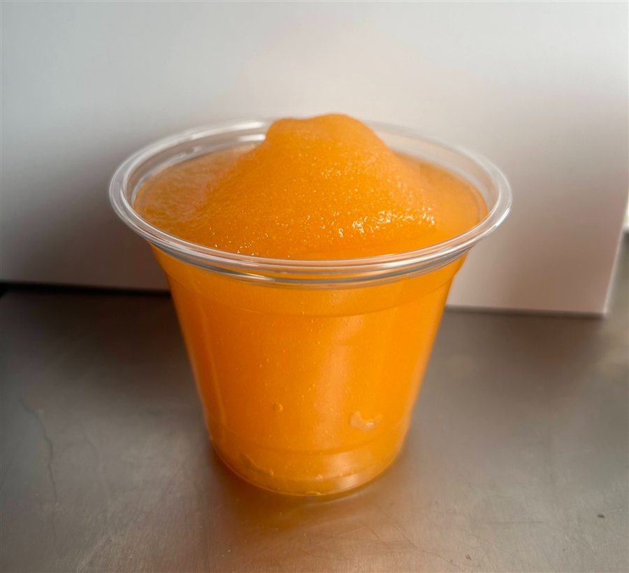 Small frozen limeade in a clear cup