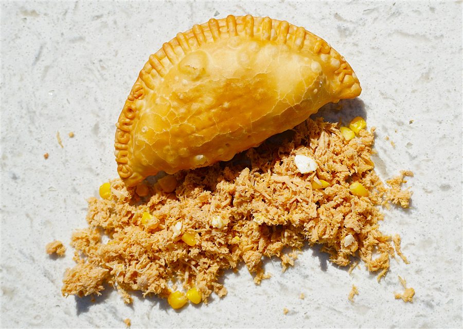Pork empanada with a golden fried crust